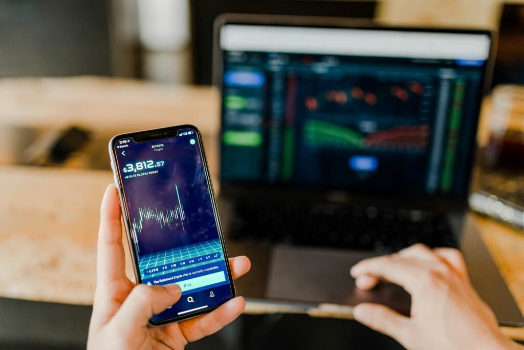 person investing in dividend stocks on phone app