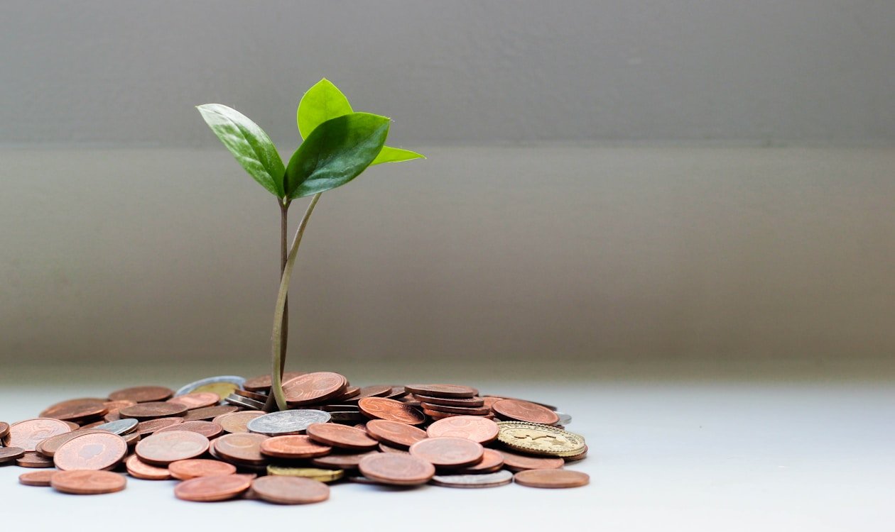 Money saved in separate jars representing different sinking funds โ what is a sinking fund 2026