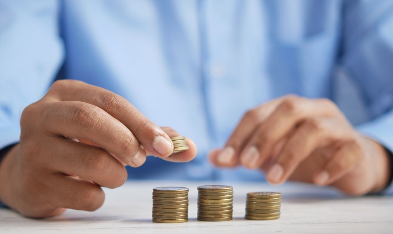 Person reviewing receipts and financial planning for sinking funds at home desk