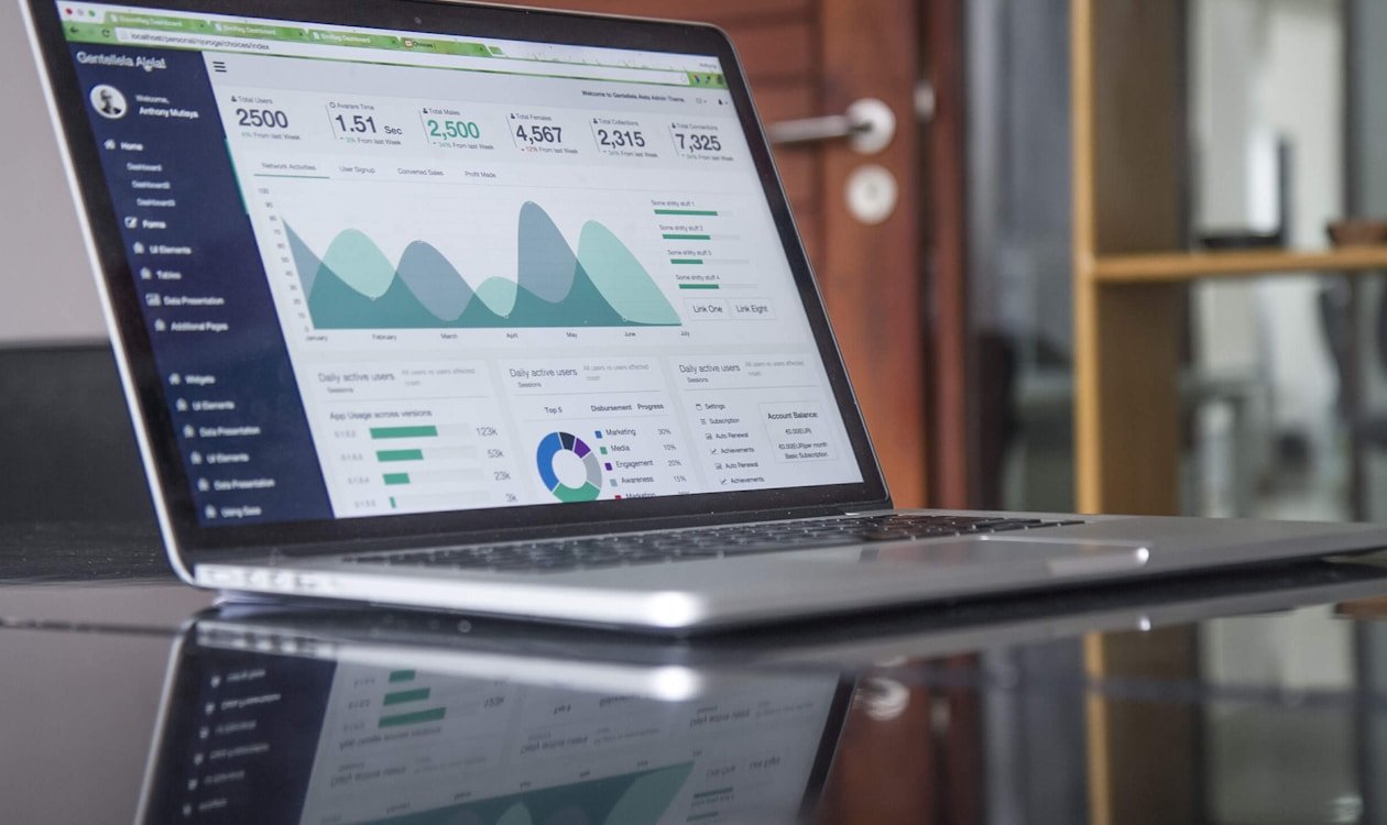 Monthly budget spreadsheet with calculator and money on desk — zero-based budgeting real example