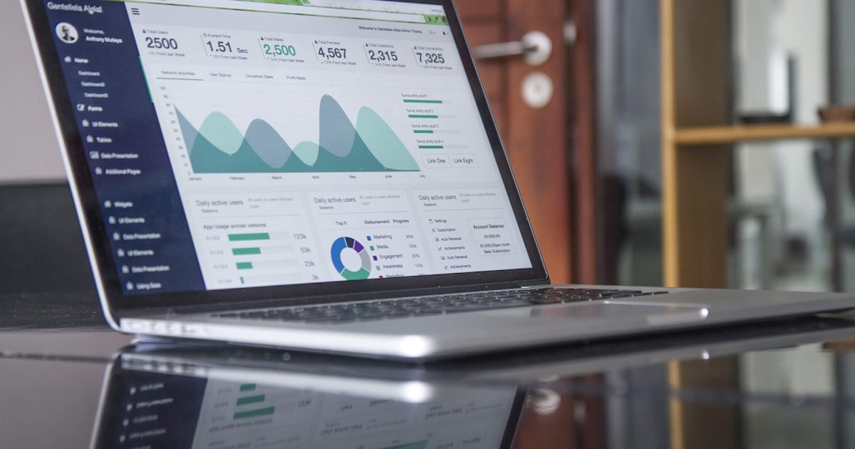 person using laptop financial budgeting app tools 2026