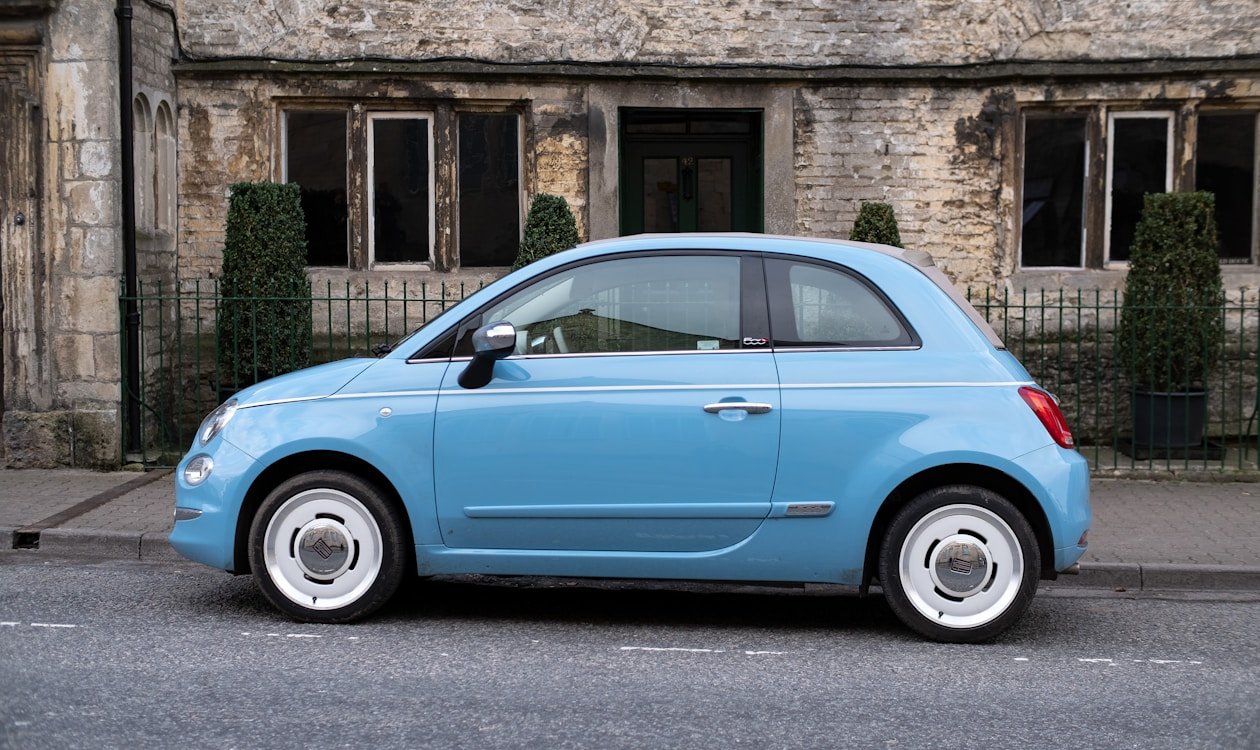 New car in showroom — how to save for a car and buy without going into debt