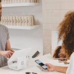 Person resisting impulse buying at shopping mall — how to stop impulse buying and save money