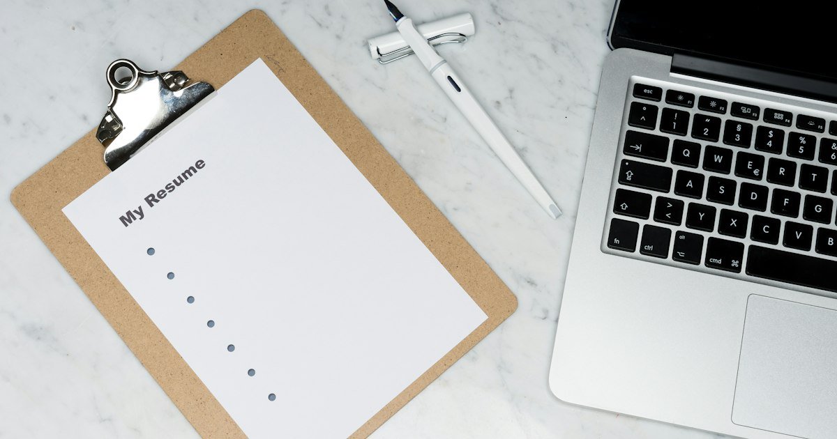 person writing financial improvement plan notebook 2026