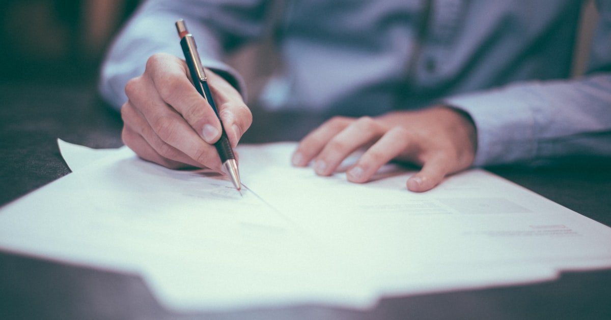 person reviewing financial documents - checking credit report for errors